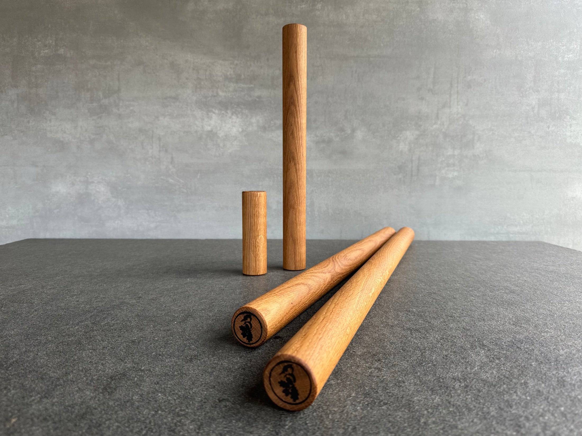 4 verschieden lange Teigrollen im Vergleich.